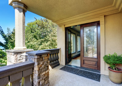 Luxury House Exterior. Entrance Column Porch With Railings.